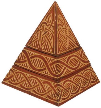 Wooden pyramid with ornate design that separates into three pieces. Item measures 6in x 6in x 8in.